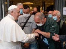 Pope Francis greets people at the Paul VI Audience Hall after a screening of the documentary “Francesco”, May 24, 2021.